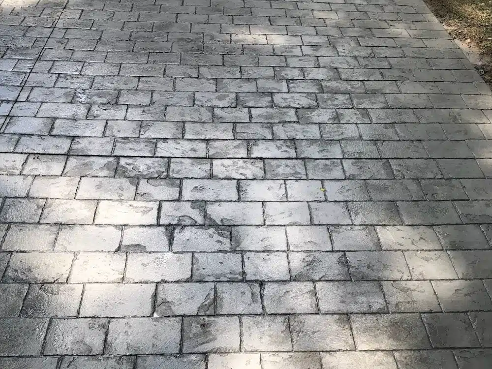 Cobblestone pattern stamped concrete walkway.